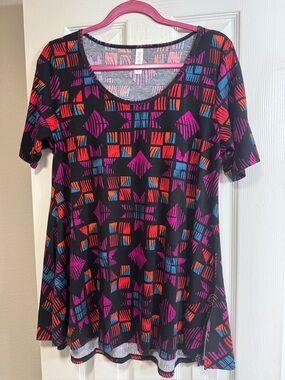 LuLaRoe Perfect Tee. Black w/ purple & pink pattern. High low hem. Side slits.